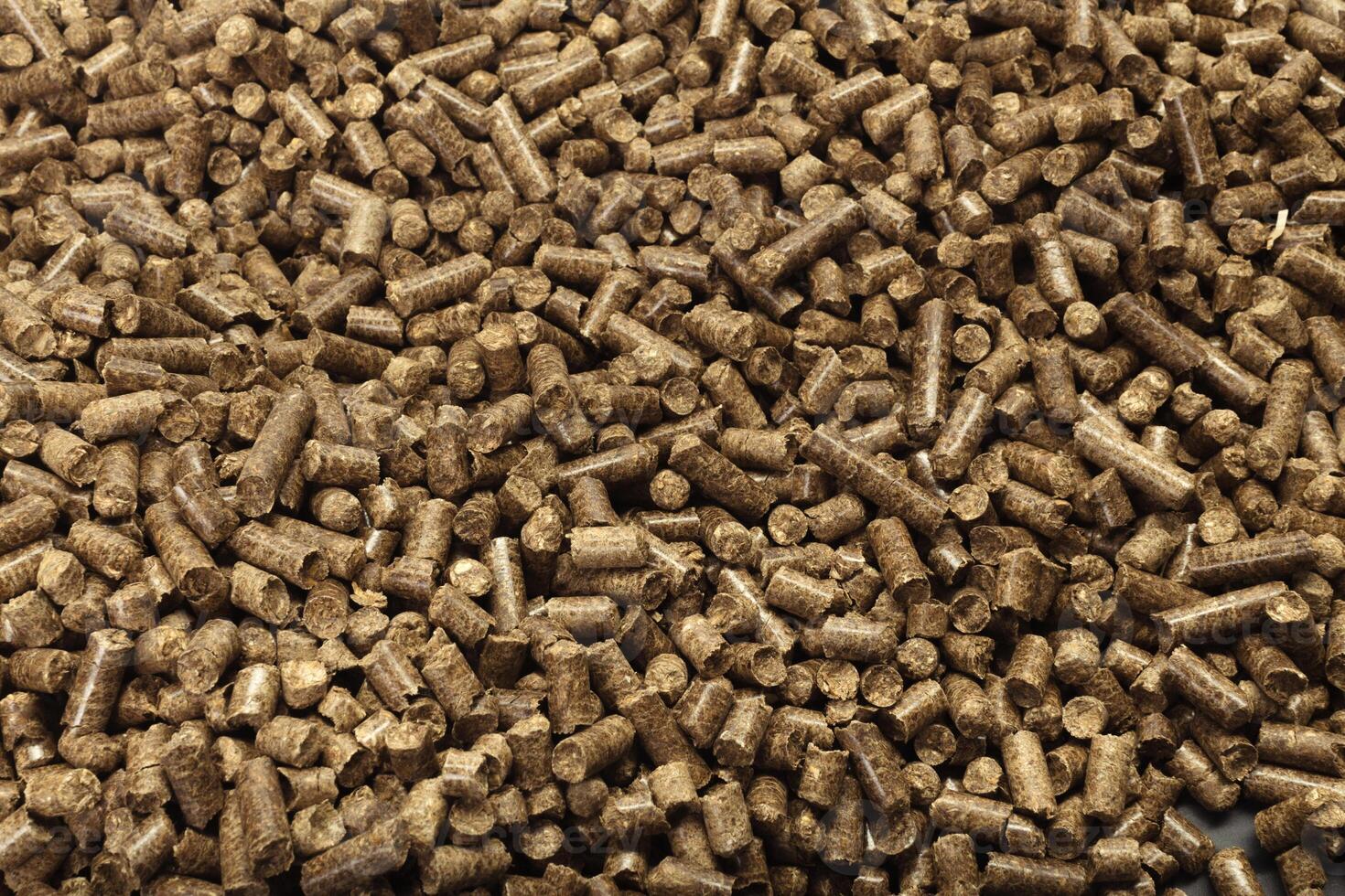 Wood pellets in the background. photo