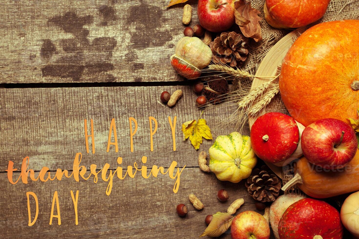Happy thanksgiving day display on wooden background photo