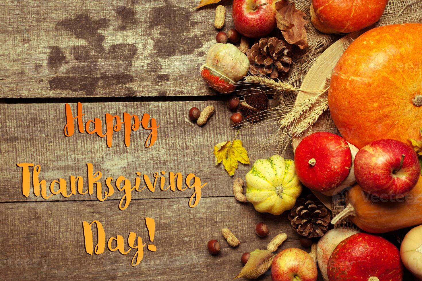 Happy thanksgiving day display on wooden background photo