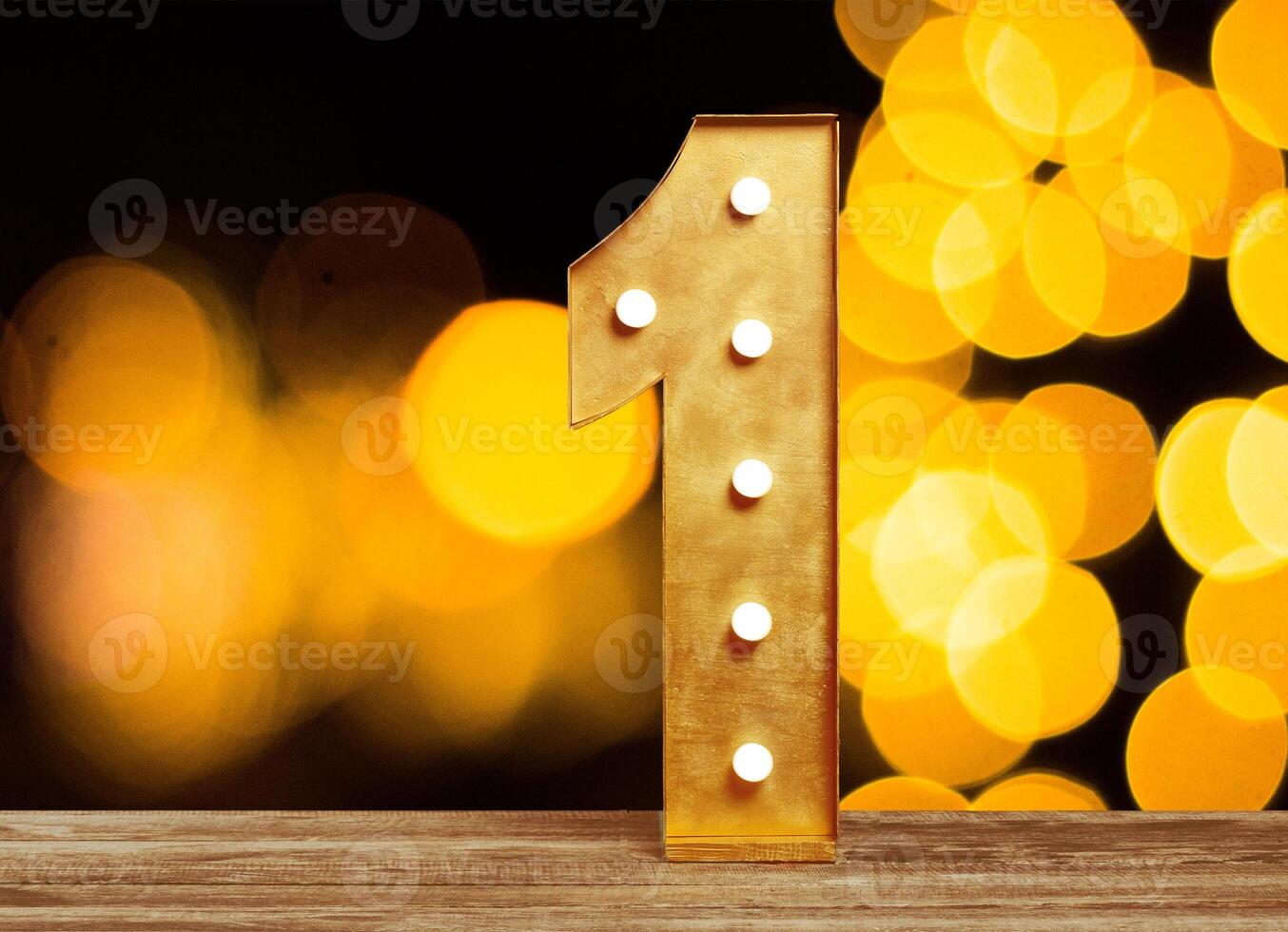 Big plastic numbers with shining light bulbs photo