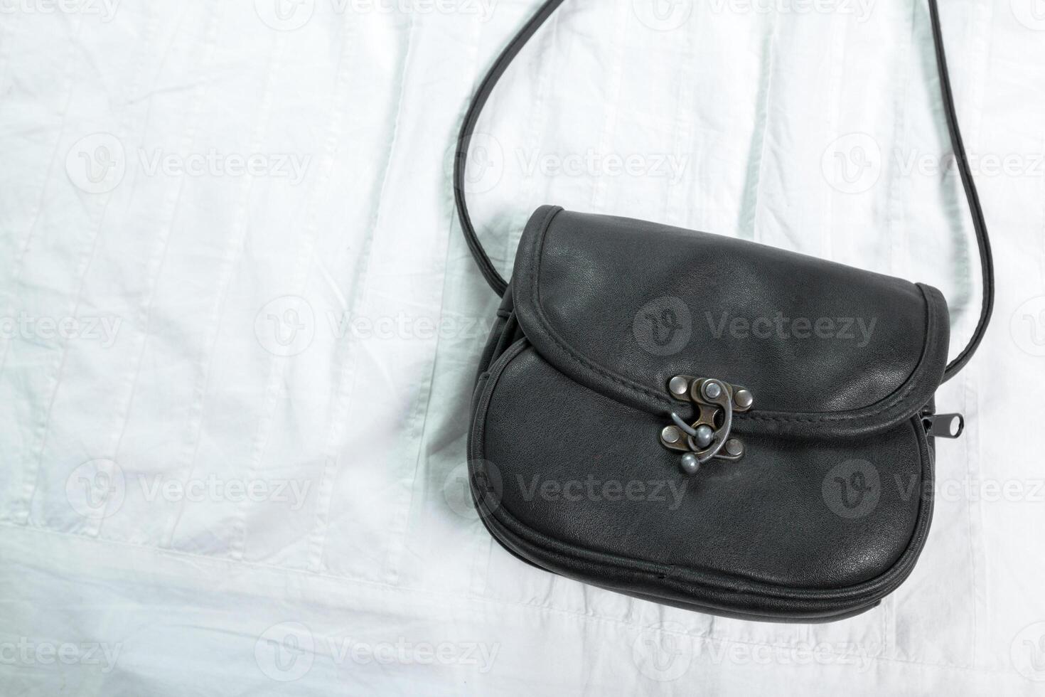 Female bag on white textile photo