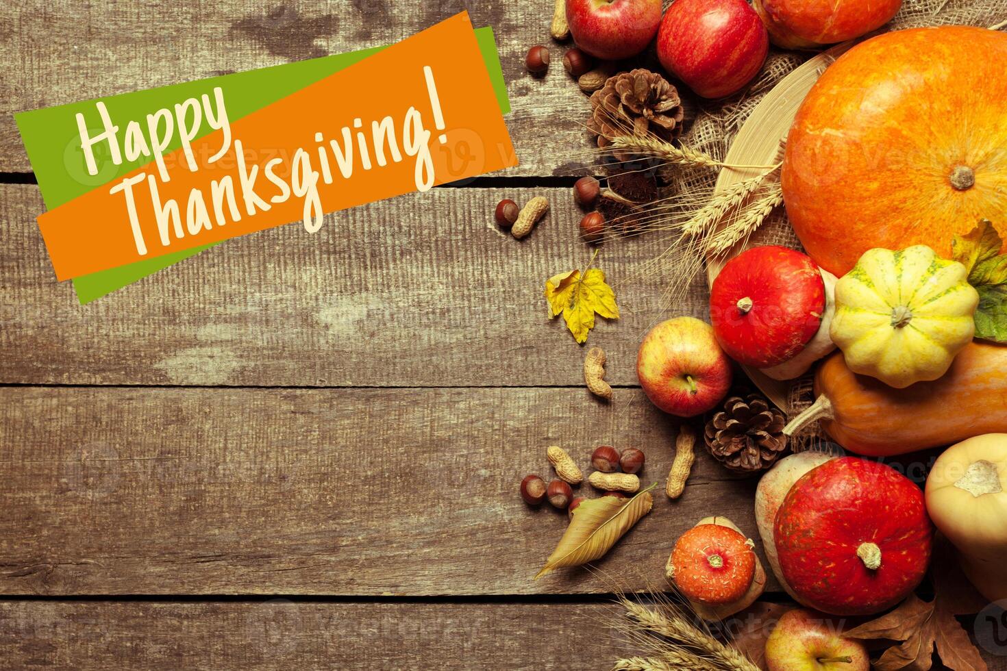 Happy thanksgiving day display on wooden background photo