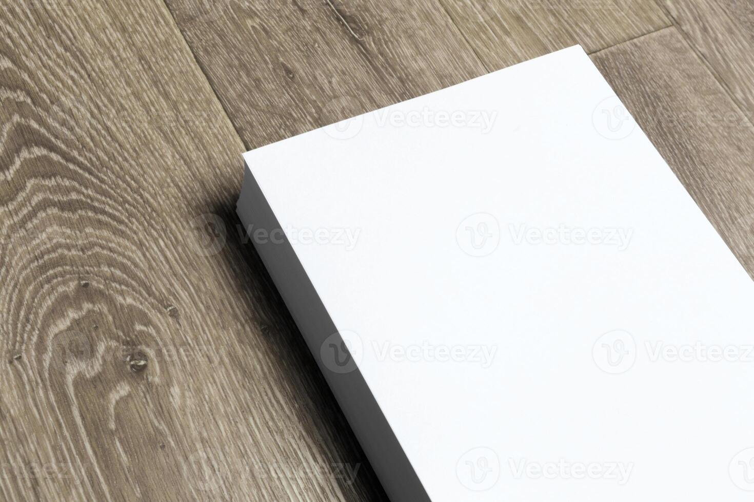 Blank paper on wood table photo