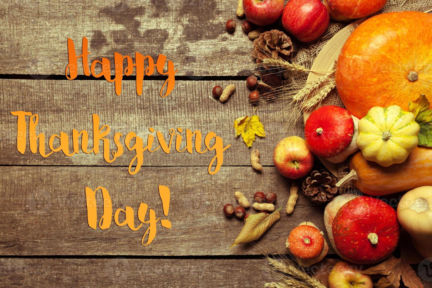 Happy thanksgiving day display on wooden background photo