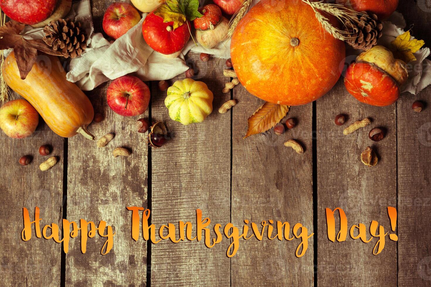 Happy thanksgiving day display on wooden background photo