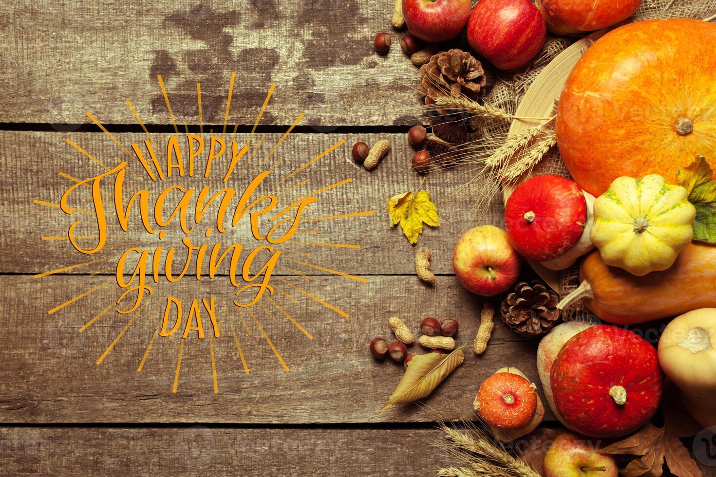 Happy thanksgiving day display on wooden background photo