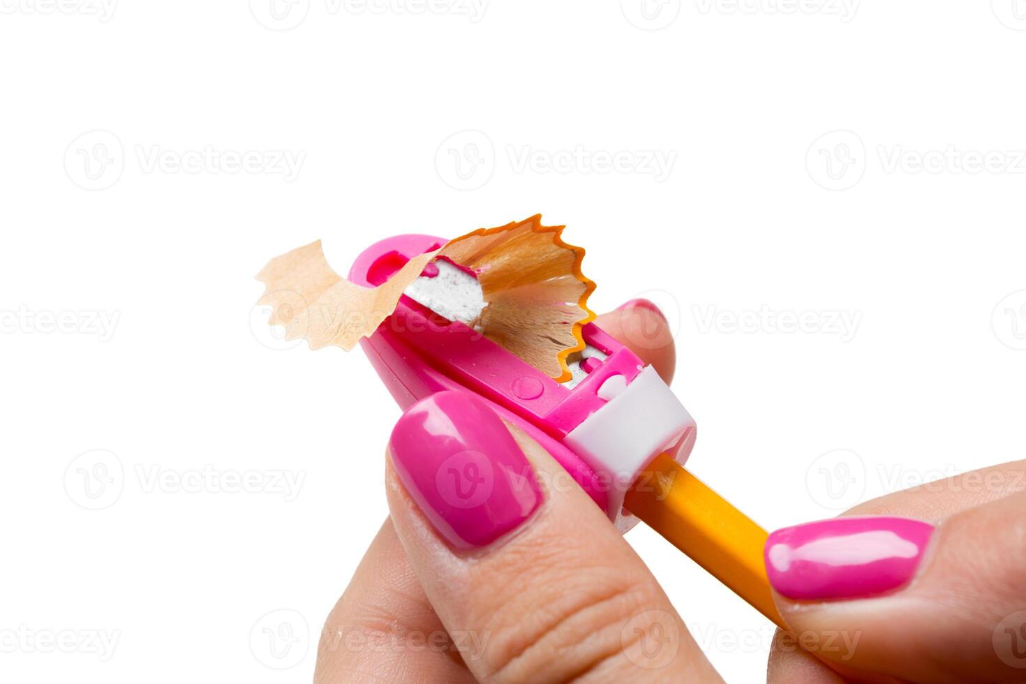 Woman is sharpening the pencil photo