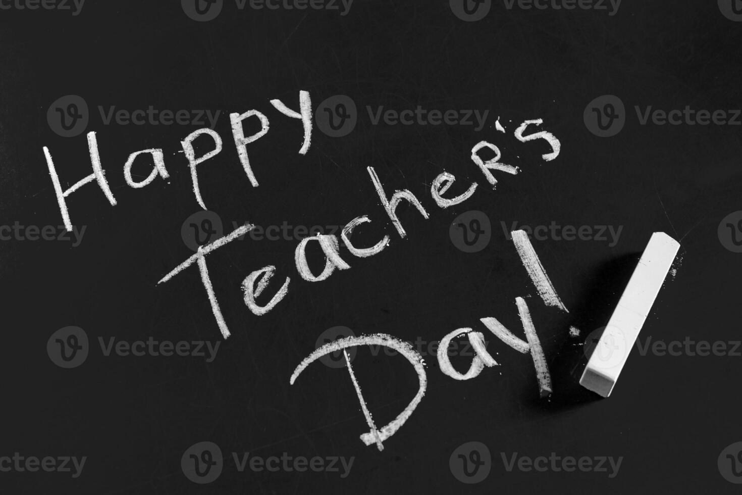 text happy teachers day written on a chalkboard photo