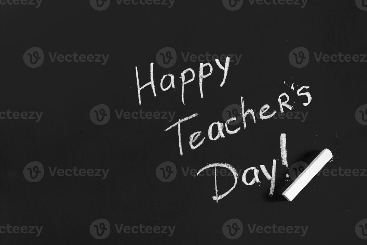 text happy teachers day written on a chalkboard photo