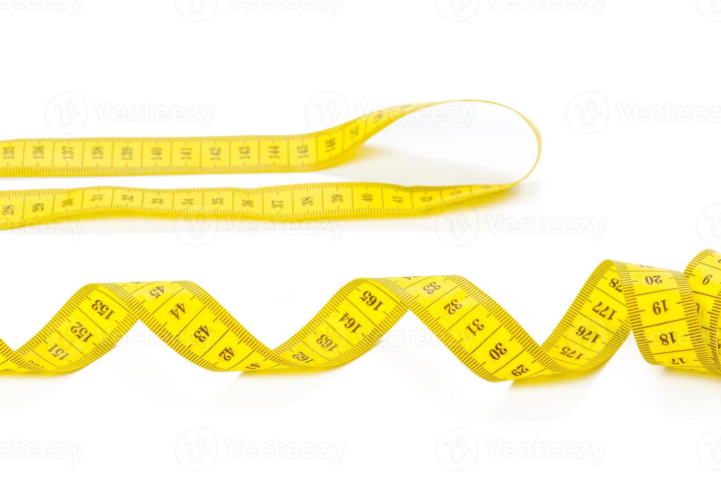 yellow metric measuring tape isolated on white panorama background photo