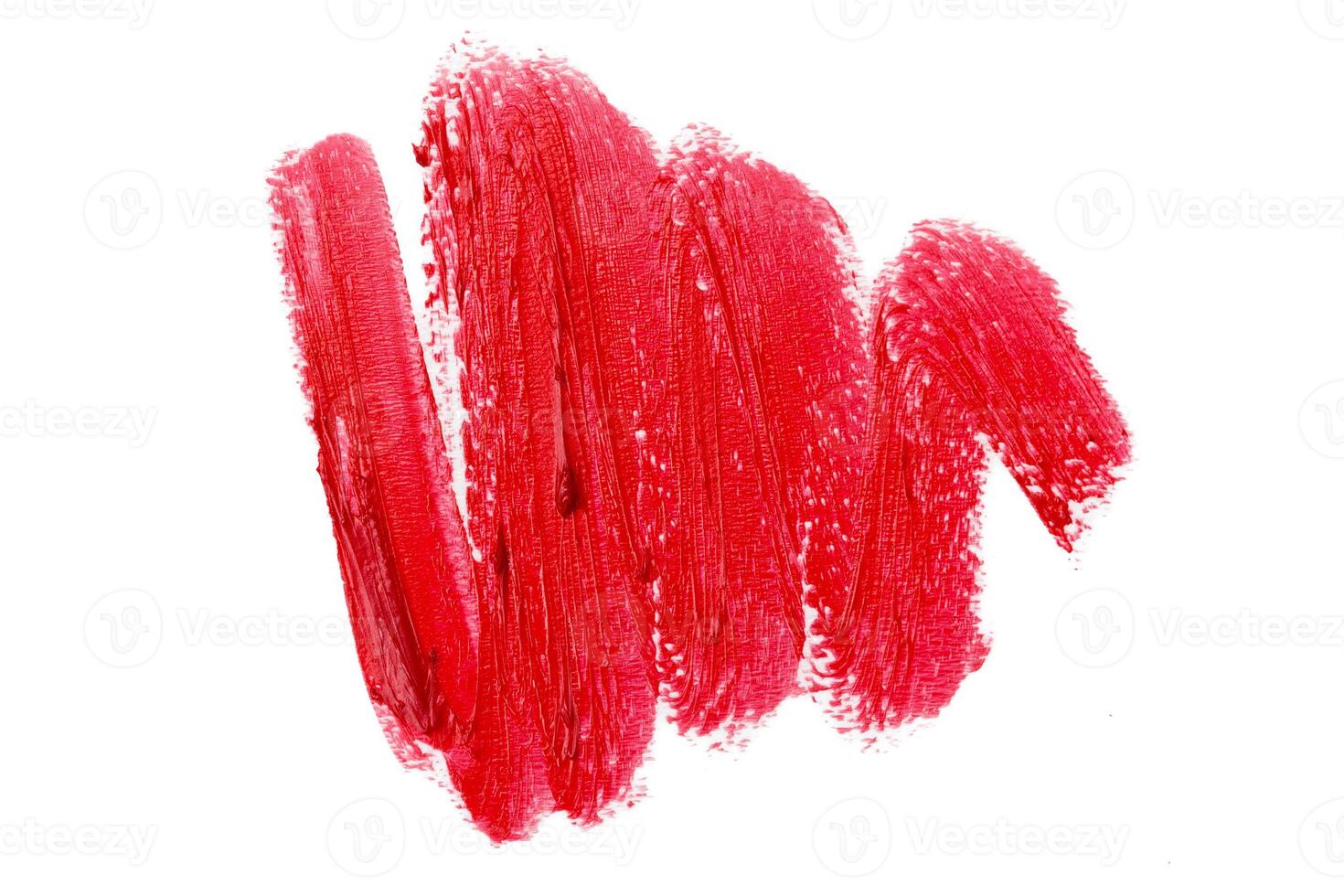 Smudged lipsticks isolated on white background photo