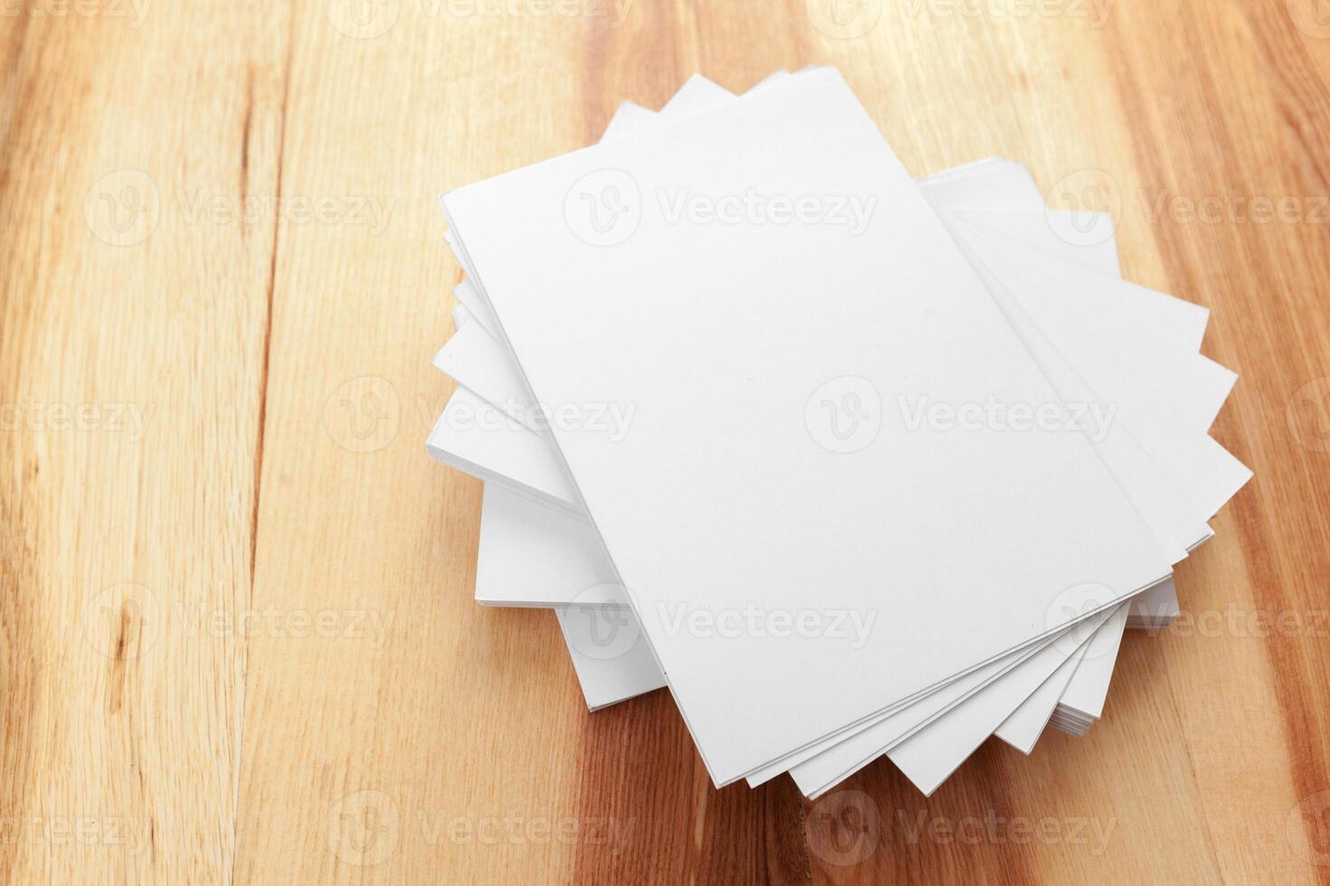 Blank paper on wood table photo
