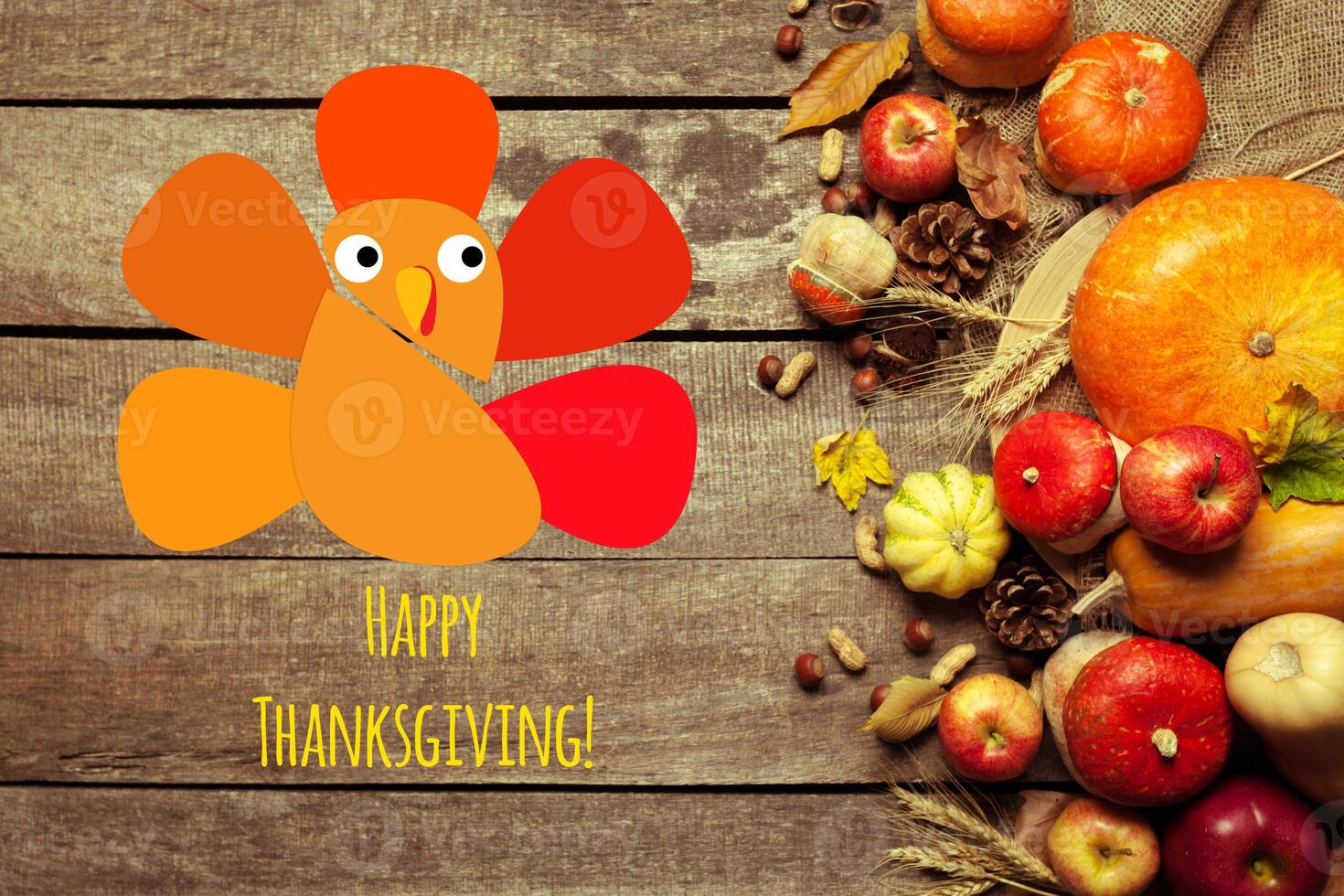 Happy thanksgiving day display on wooden background photo