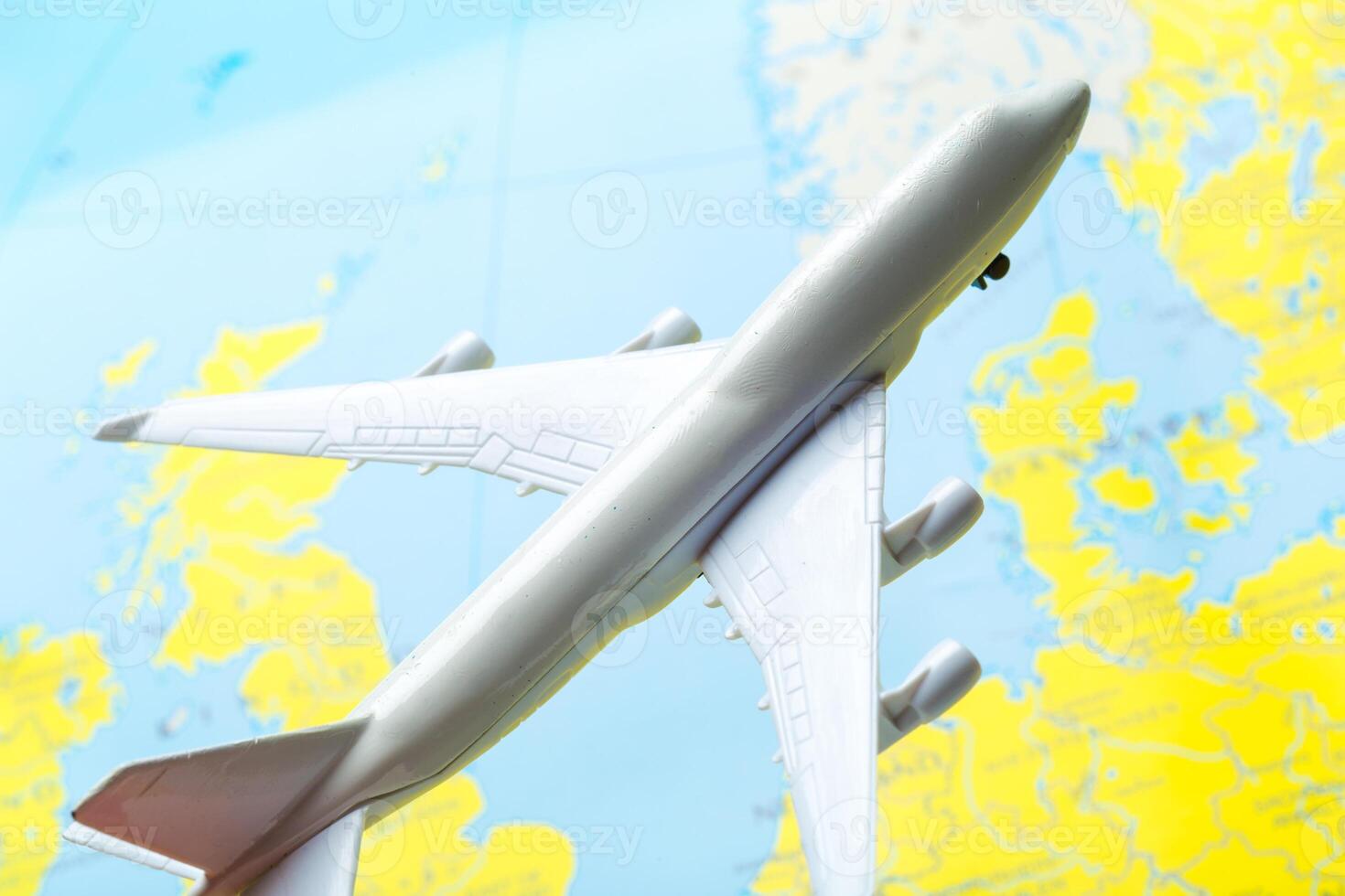 miniature of a passenger aircraft flying on a map photo