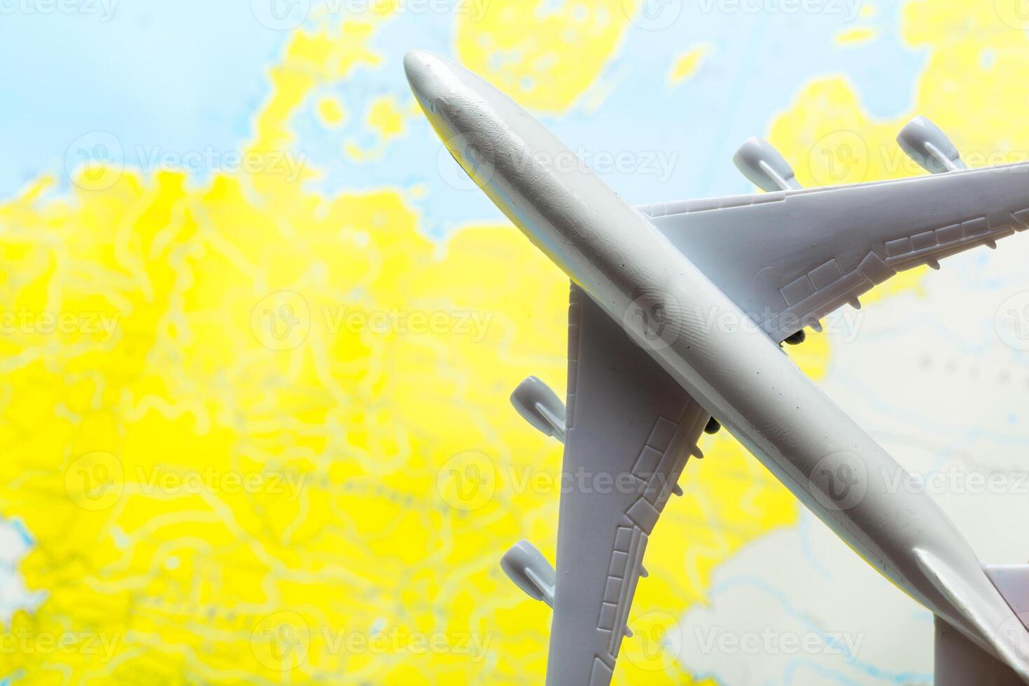 miniature of a passenger aircraft flying on a map photo
