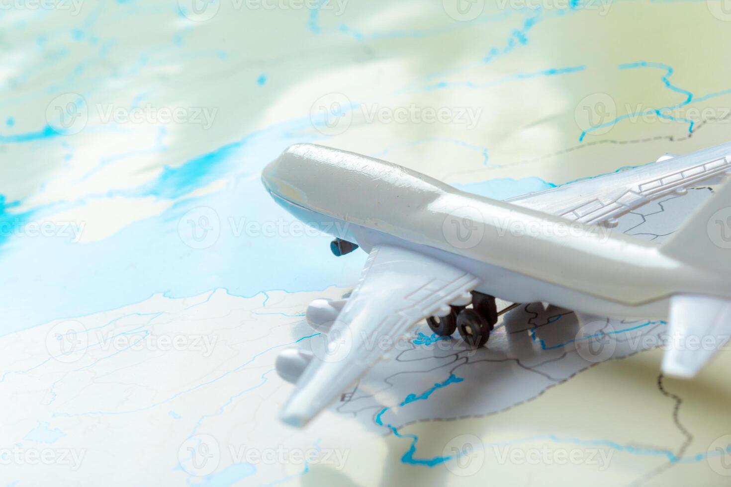 miniature of a passenger aircraft flying on a map photo