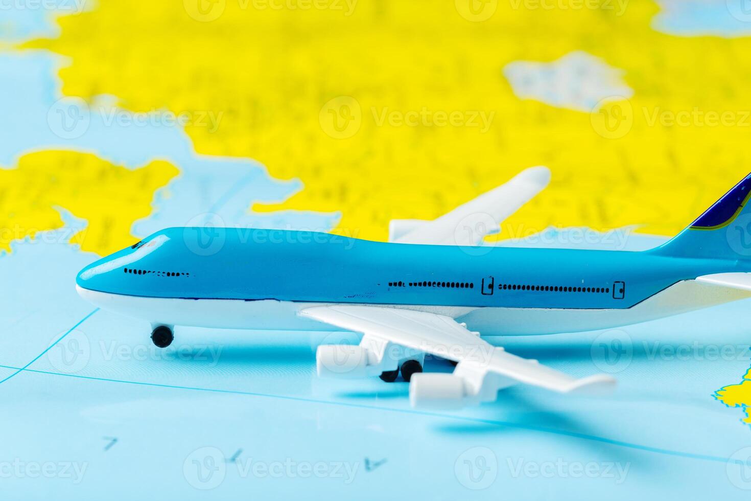 miniature of a passenger aircraft flying on a map photo