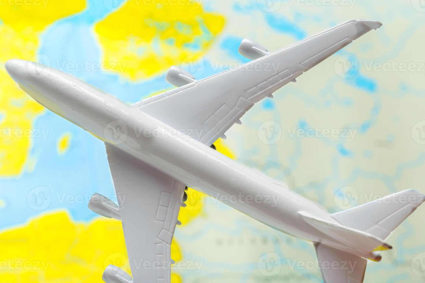 miniature of a passenger aircraft flying on a map photo