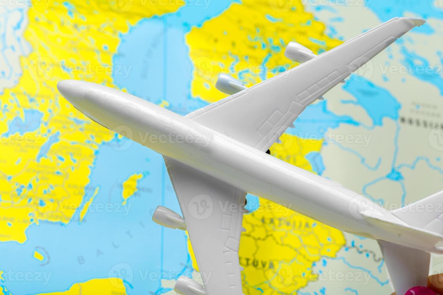 miniature of a passenger aircraft flying on a map photo