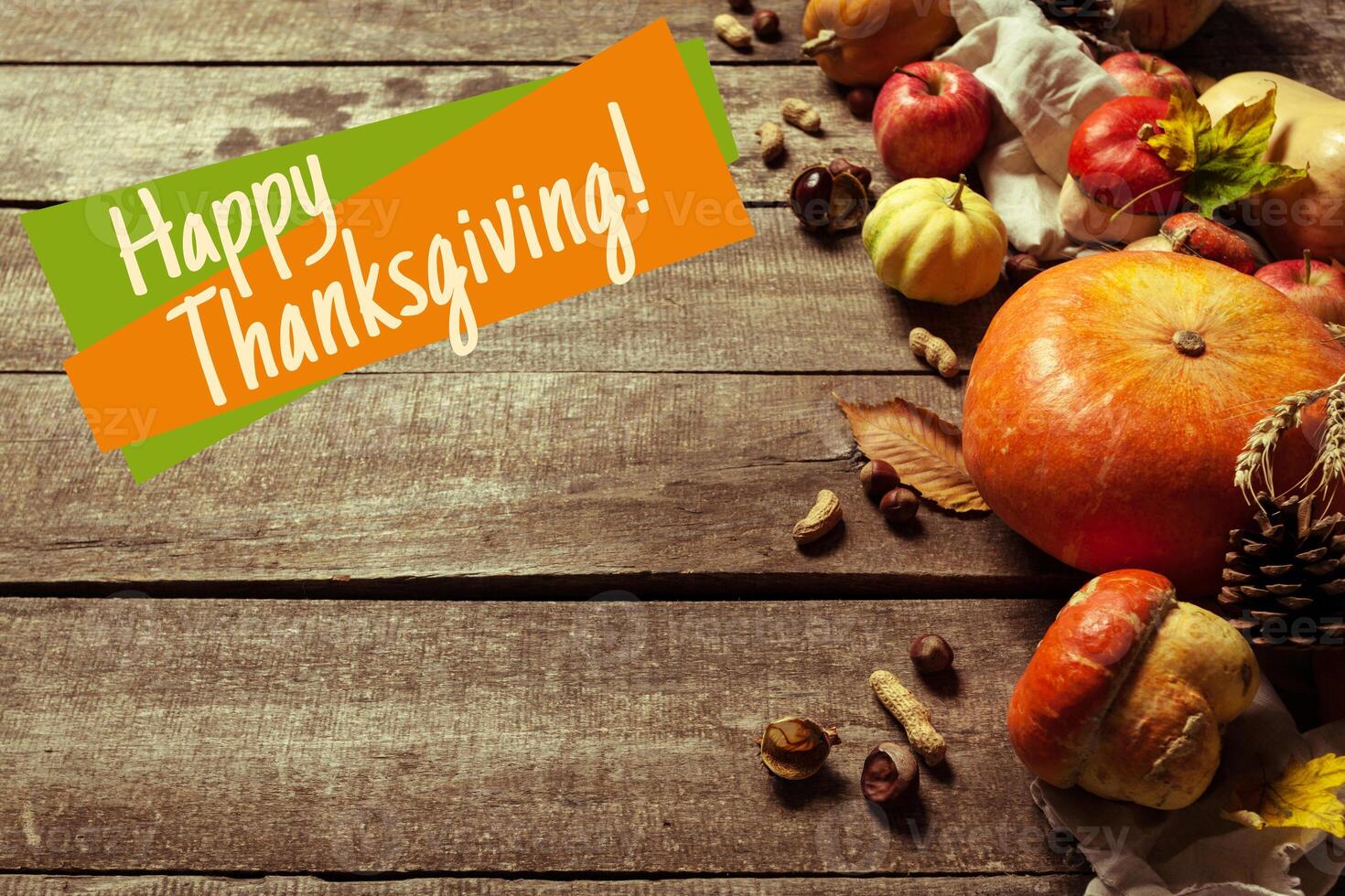 Happy thanksgiving day display on wooden background photo