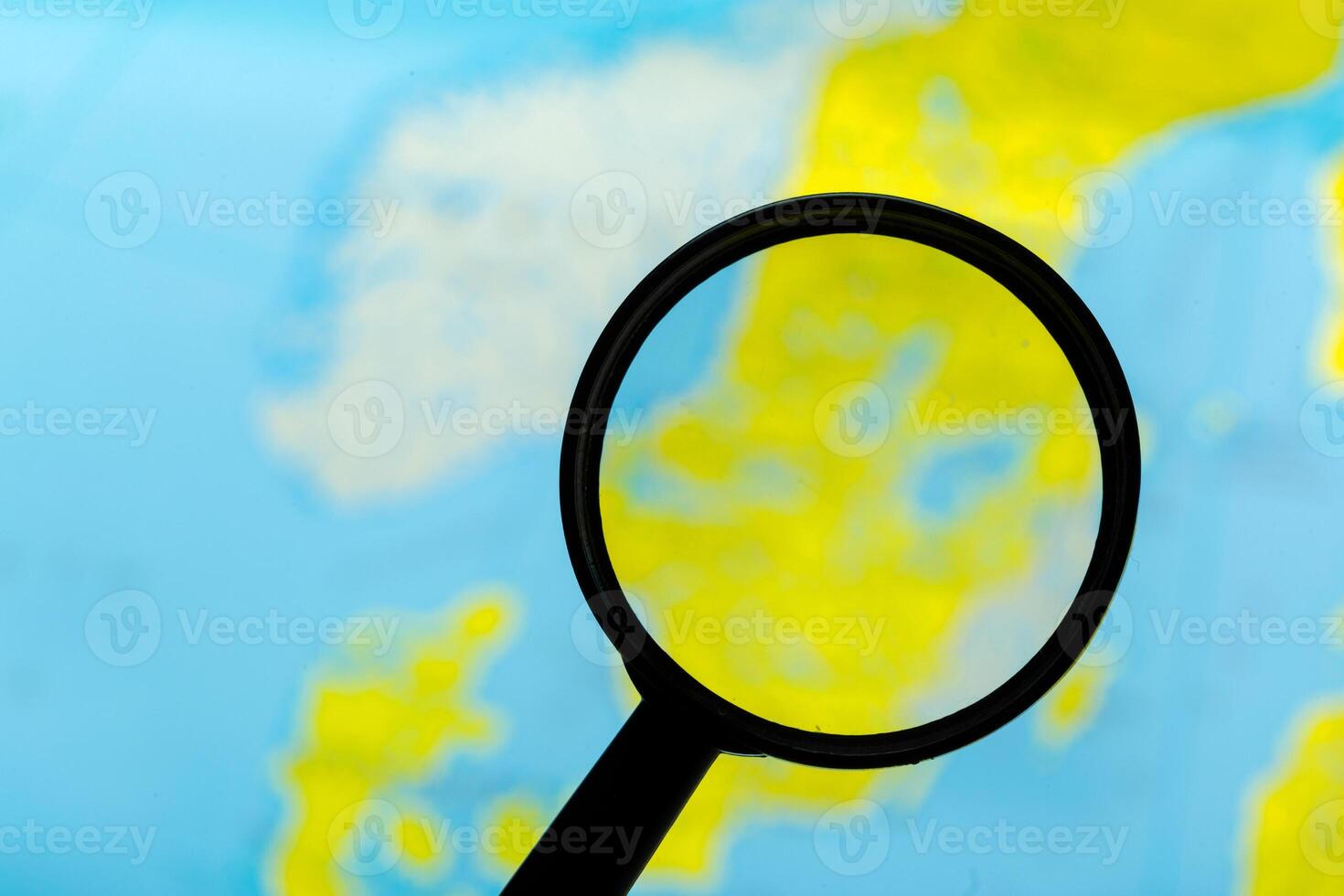 Magnifying glass and map photo