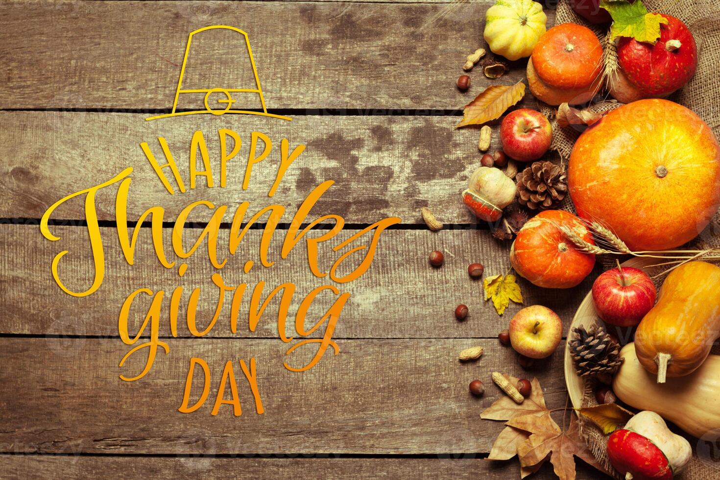 Happy thanksgiving day display on wooden background photo