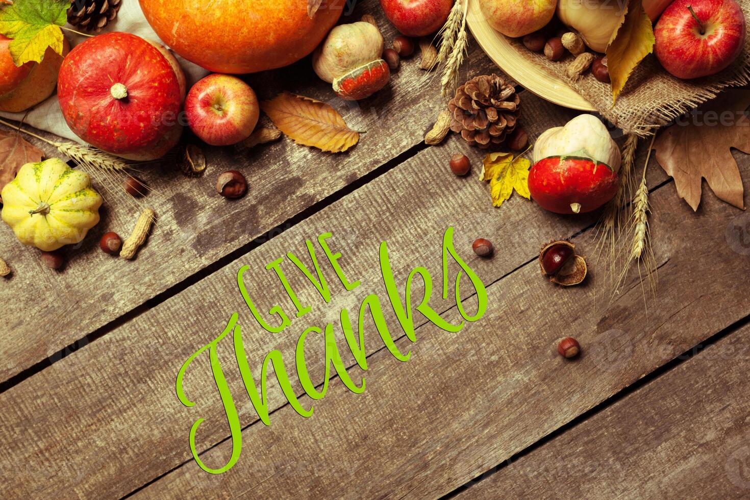 Happy thanksgiving day display on wooden background photo