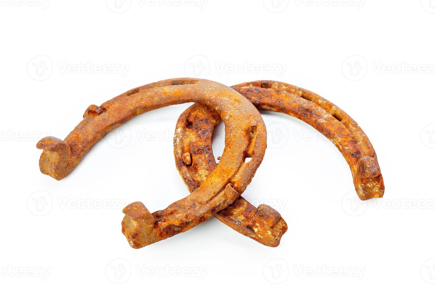 Old rusty horseshoe isolated on white photo