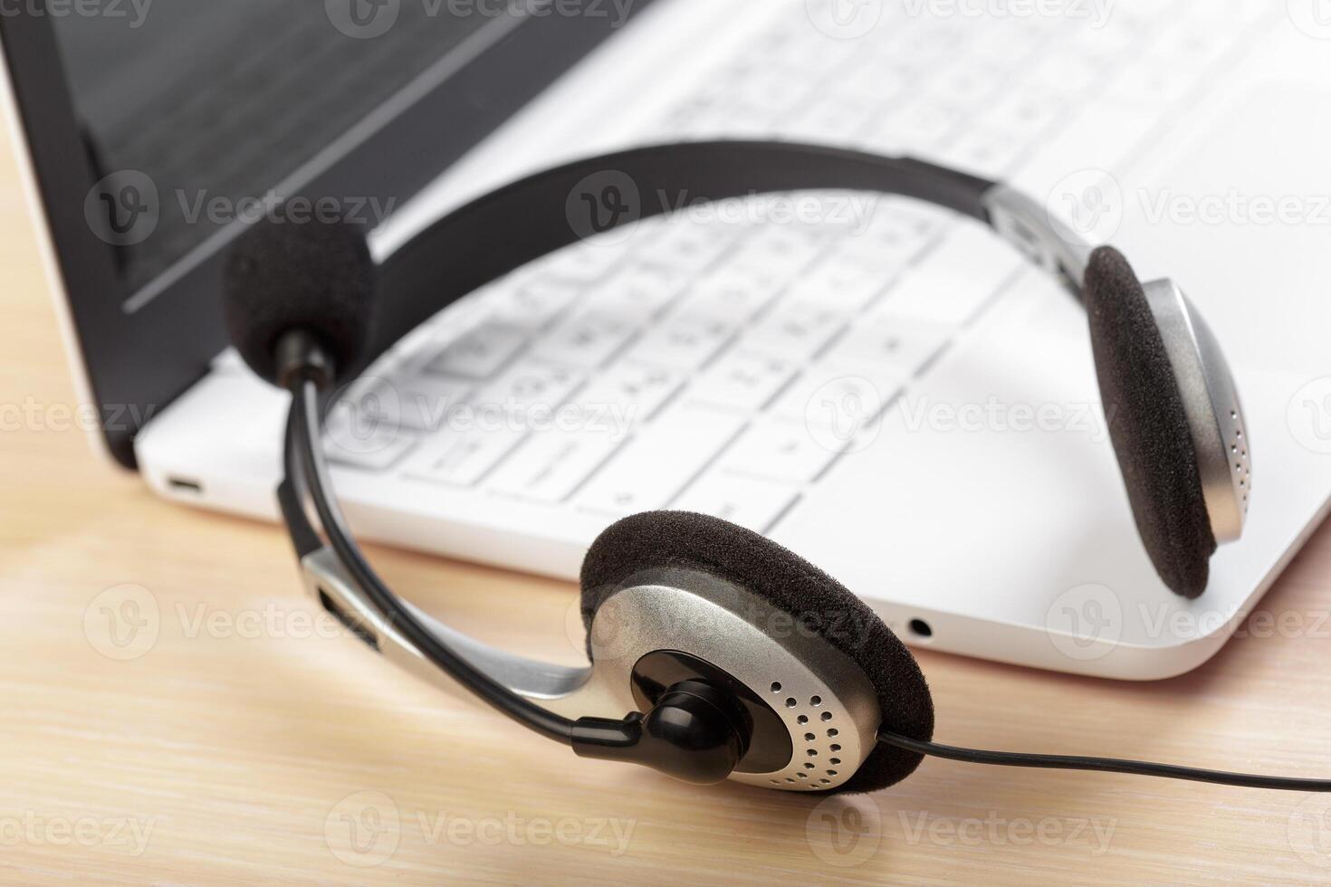 headset on keyboard computer laptop photo