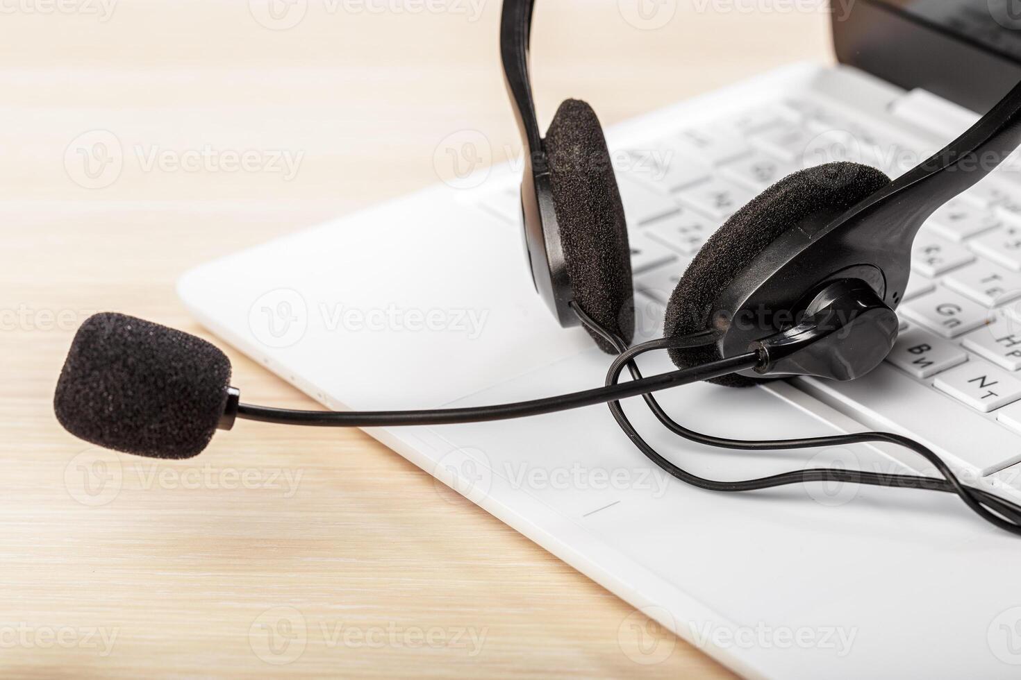 headset on keyboard computer laptop photo