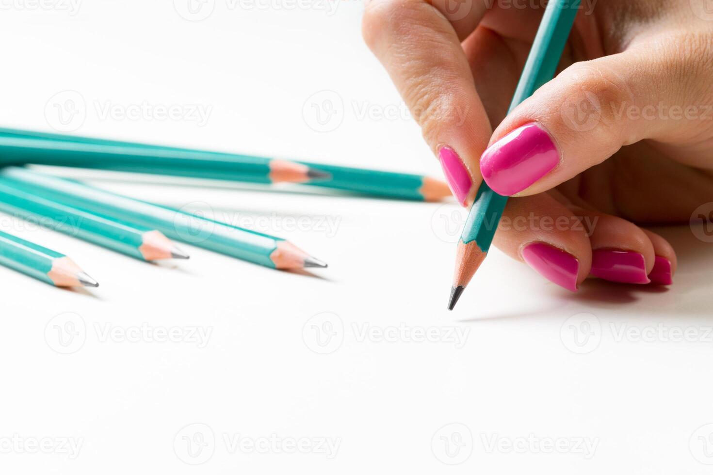 Woman's hand with a pencil photo