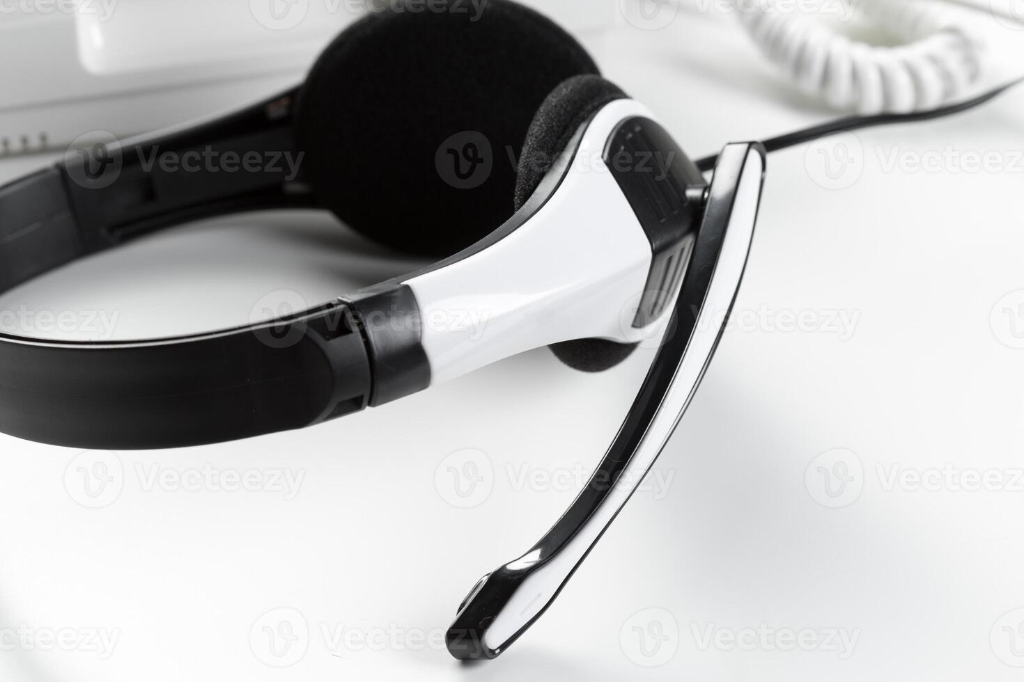 call center support concept. headset on keyboard computer laptop photo