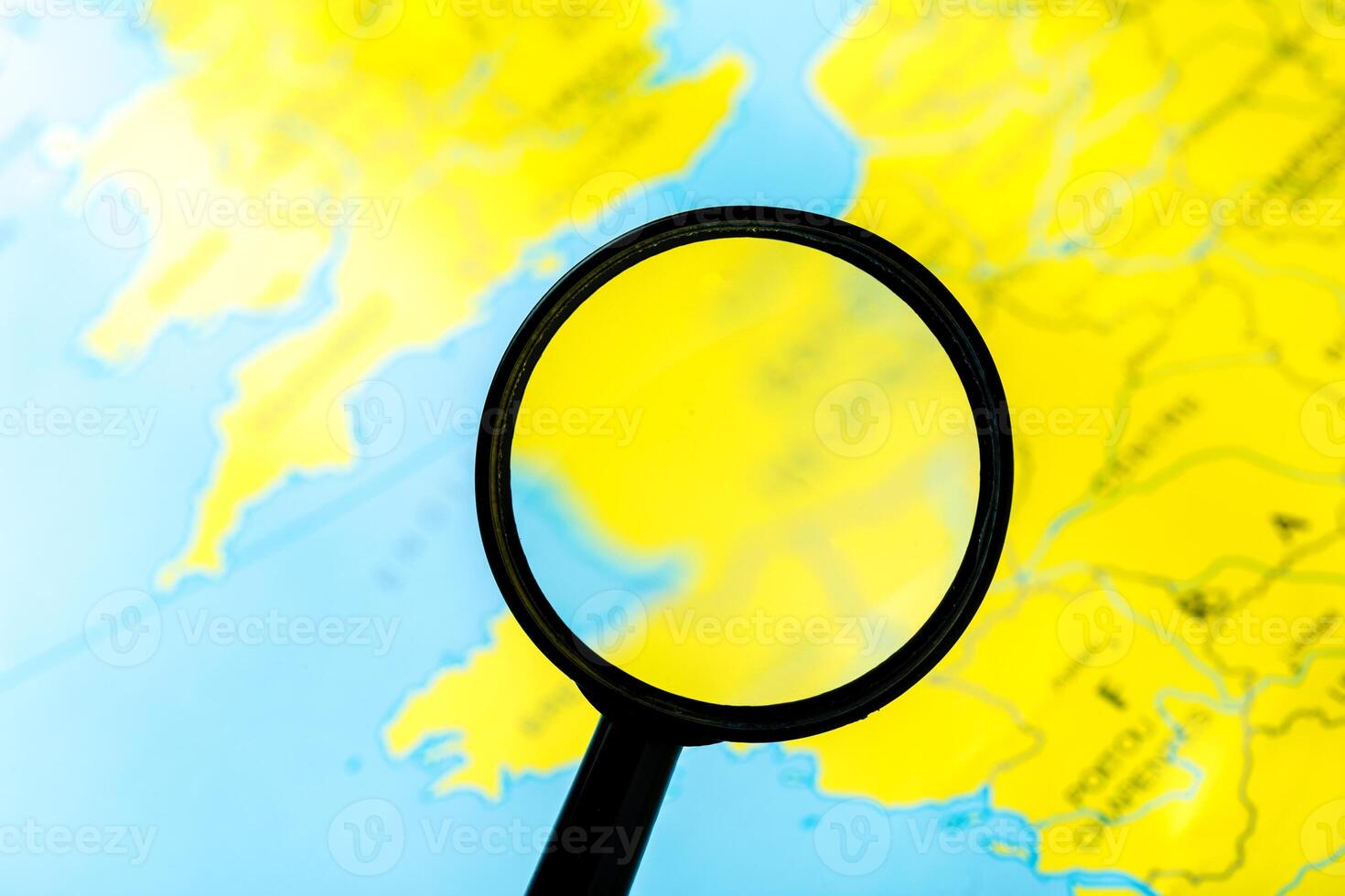 Magnifying glass and map photo
