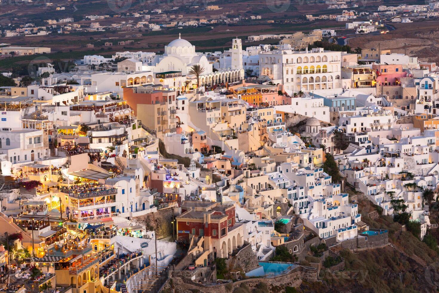 View of Fira at sunset on Santorini island, Greece. photo