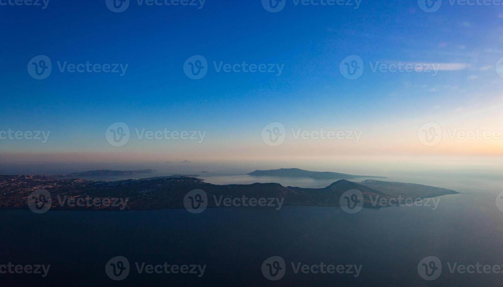 Aerial view of Santorini island as seen from plane window photo