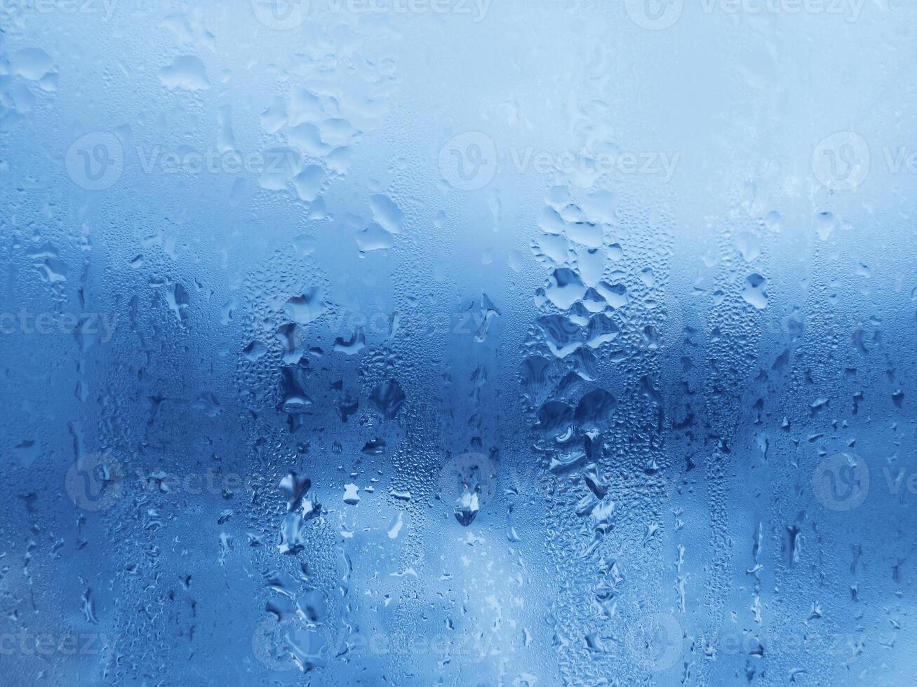 Natural water drops on glass photo