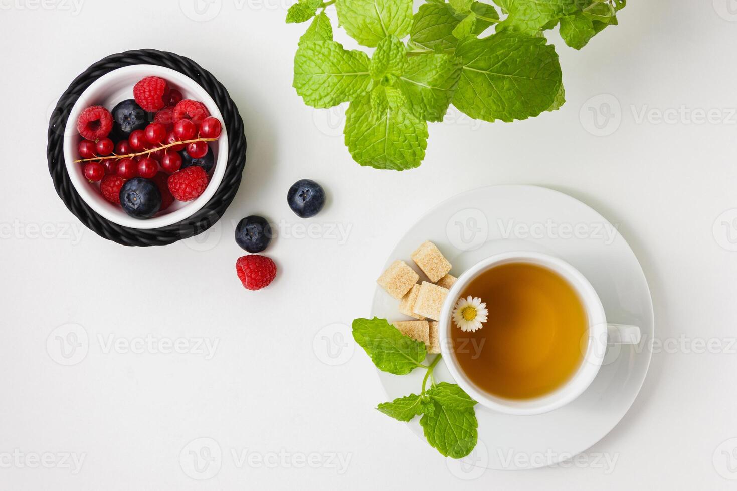 Chamomile tea with mint and berries. photo
