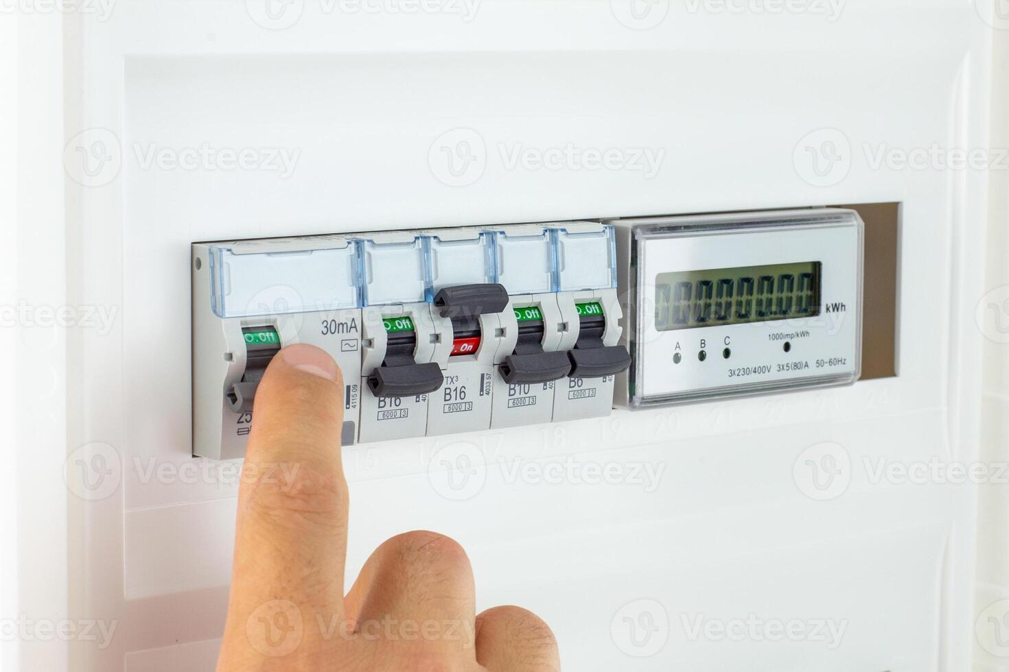 Hand Switching Modern Electrical Panel Circuit Breaker photo