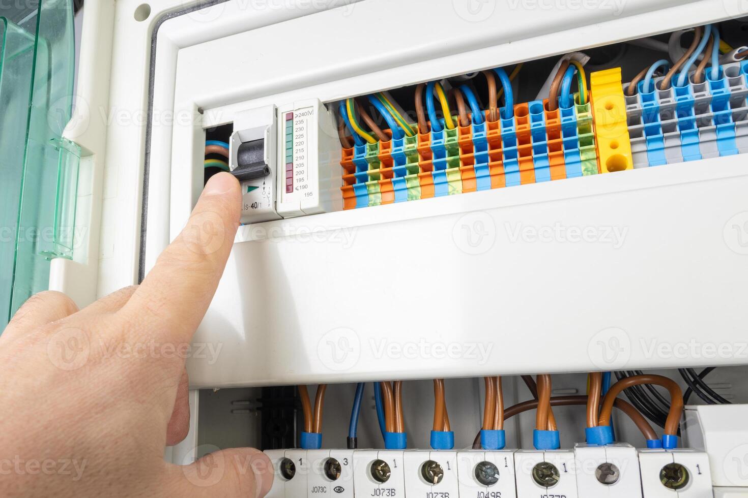 Hand Operating Electrical Circuit Breaker in Control Panel photo