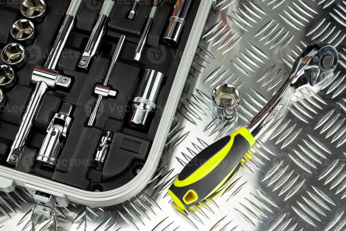Socket Wrench Set with Tools on Metal Surface photo