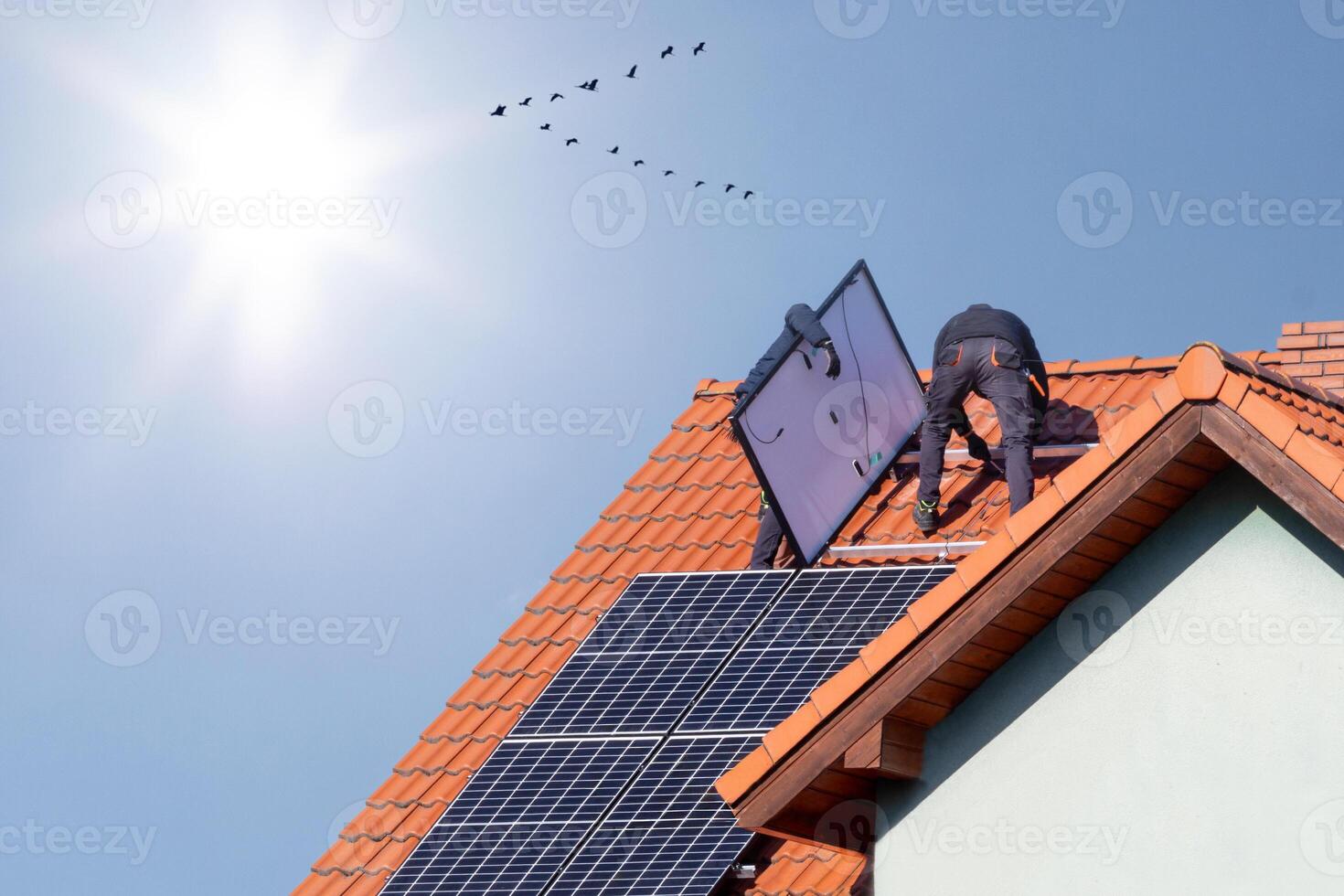Solar Panel Installation on Rooftop with Bright Sun photo