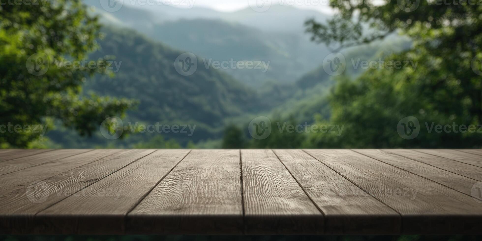 Scenic mountain view from a rustic wooden table during daytime photo