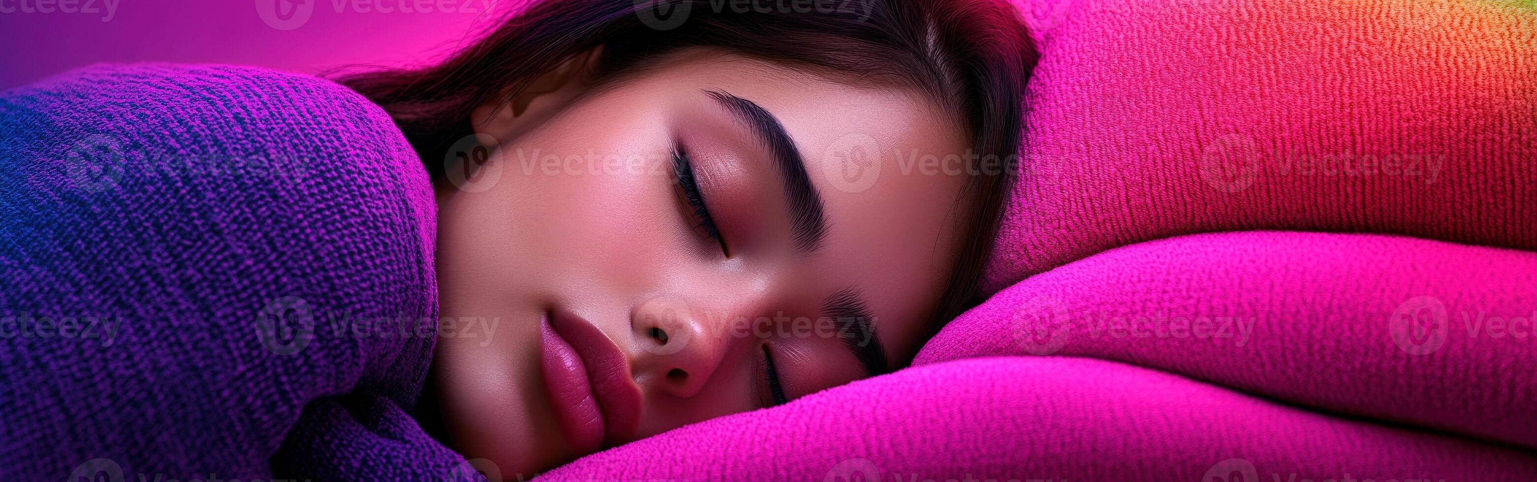 Young woman resting peacefully on a colorful blanket at twilight photo