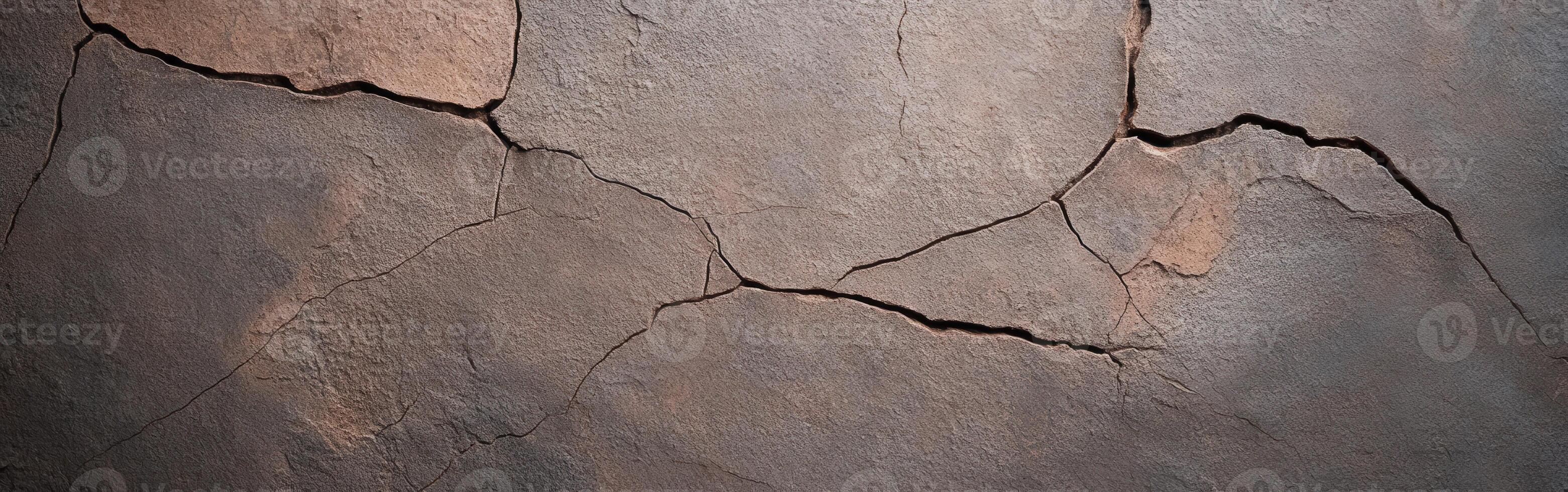 Cracked textured wall revealing aged surface and imperfections photo