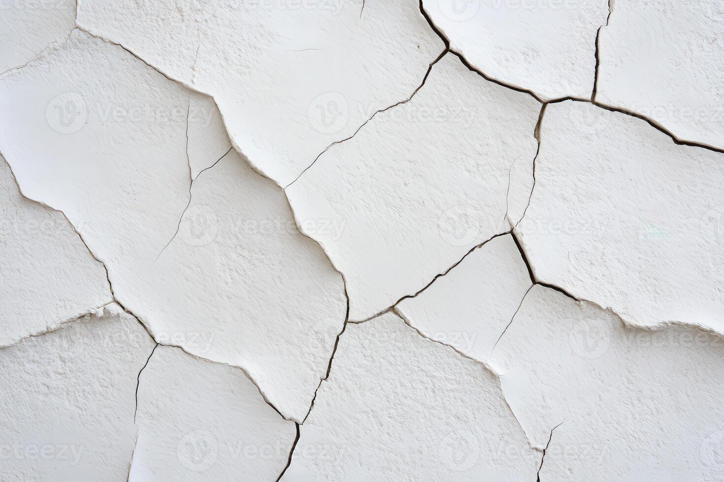 Cracked white wall texture showing signs of age and wear photo
