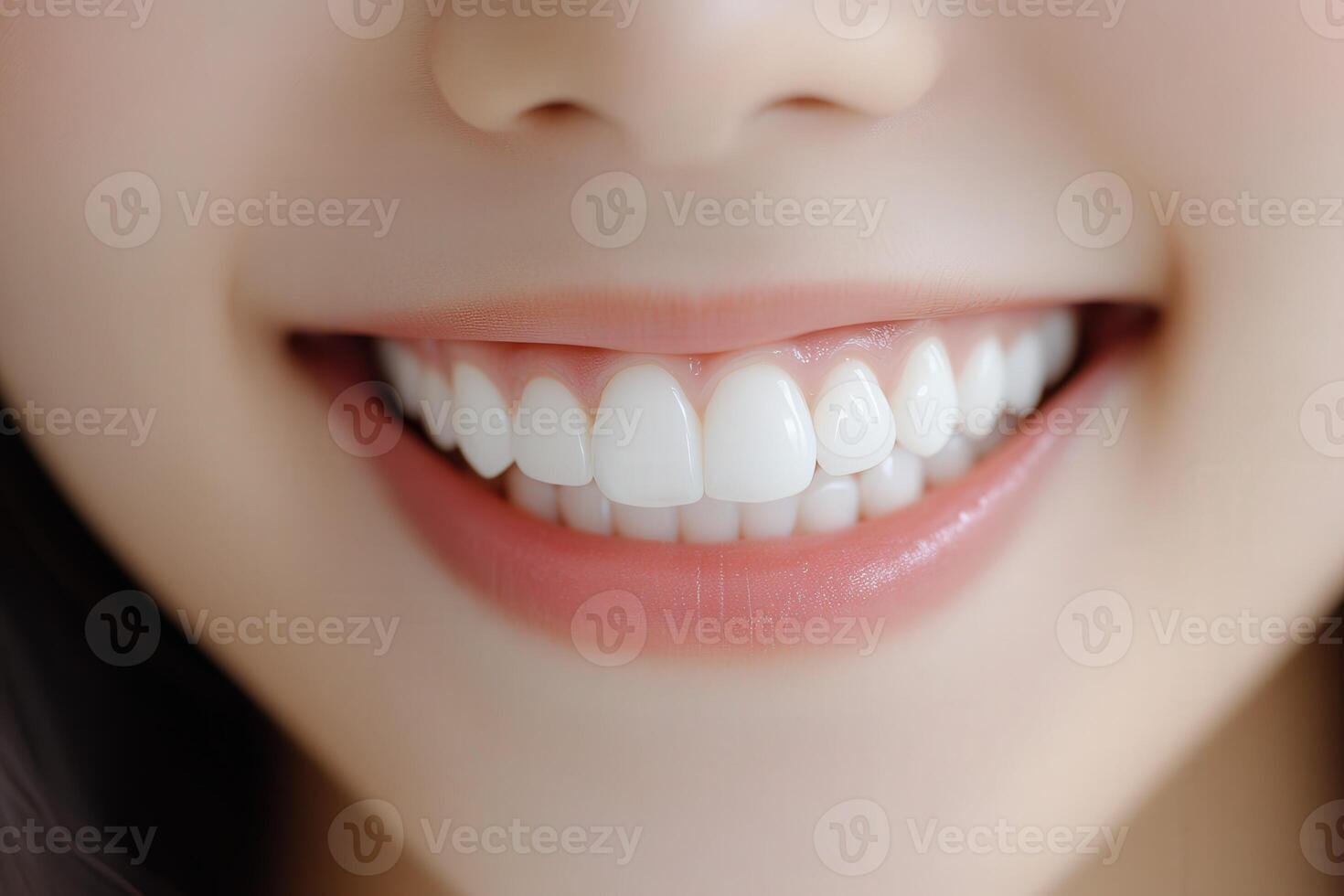 Bright white smile of a young woman showcasing dental health outdoors photo