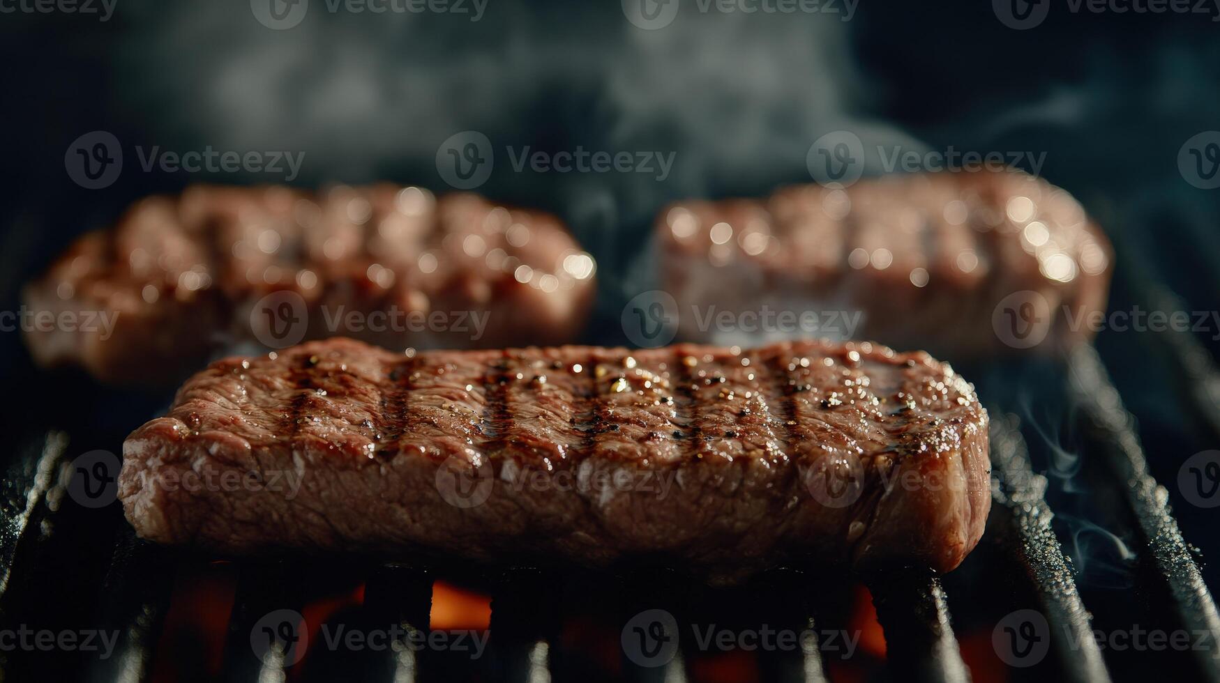 Grilling juicy beef steaks over open flames in a backyard setting photo