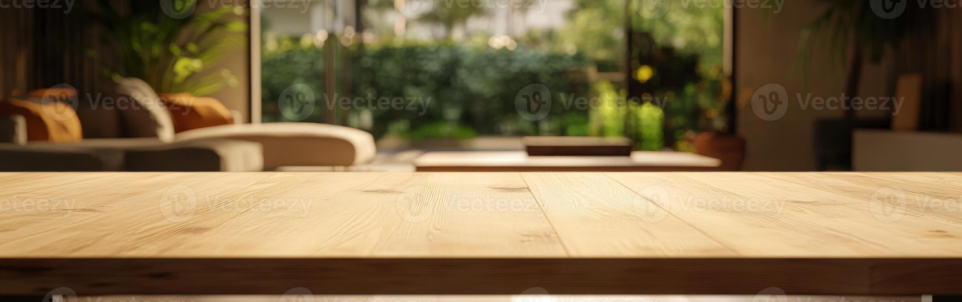 Bright living room with wooden table and lush garden view in daylight photo