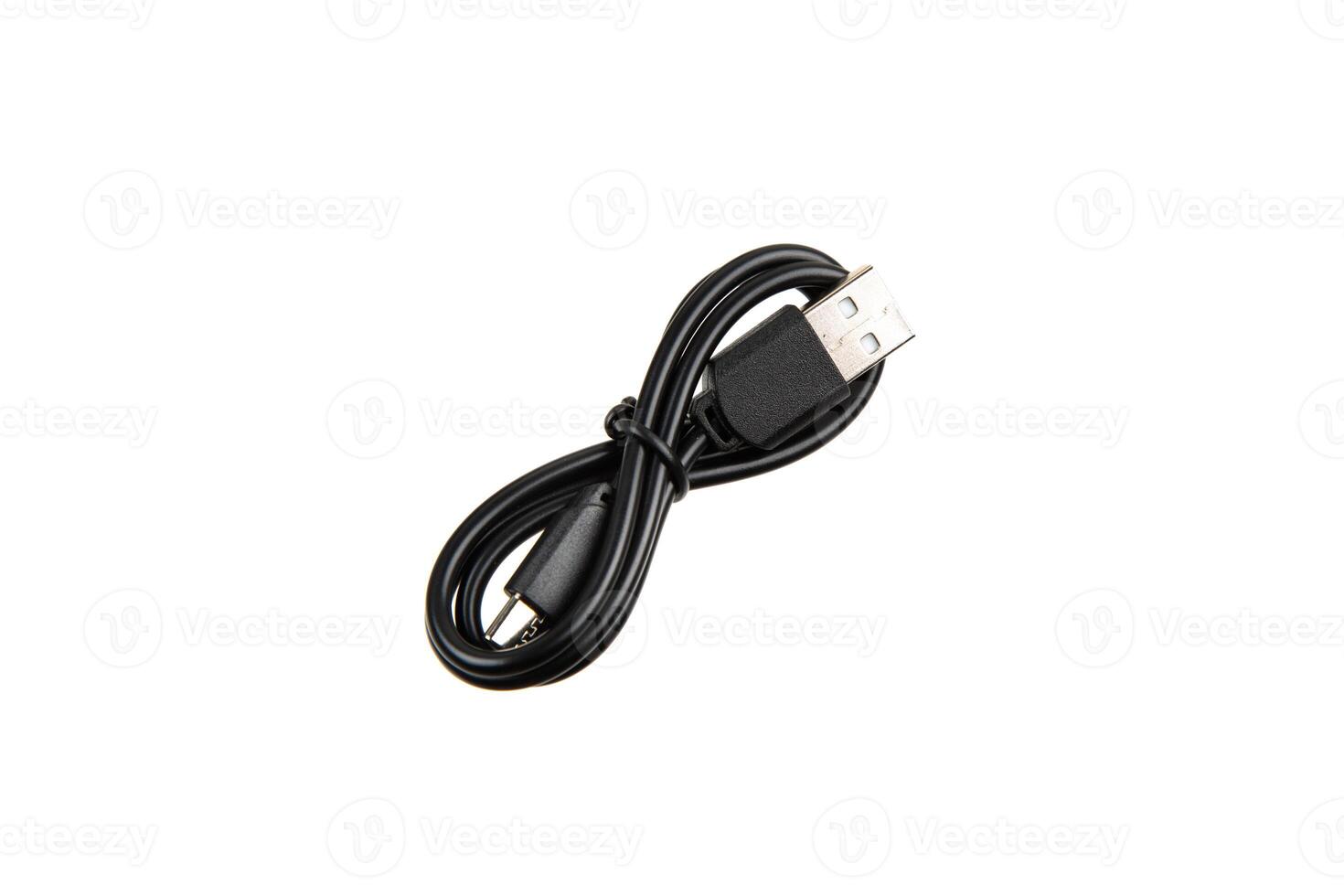 Black USB cable with two connectors, neatly coiled and secured with a strap, isolated on a white background. photo