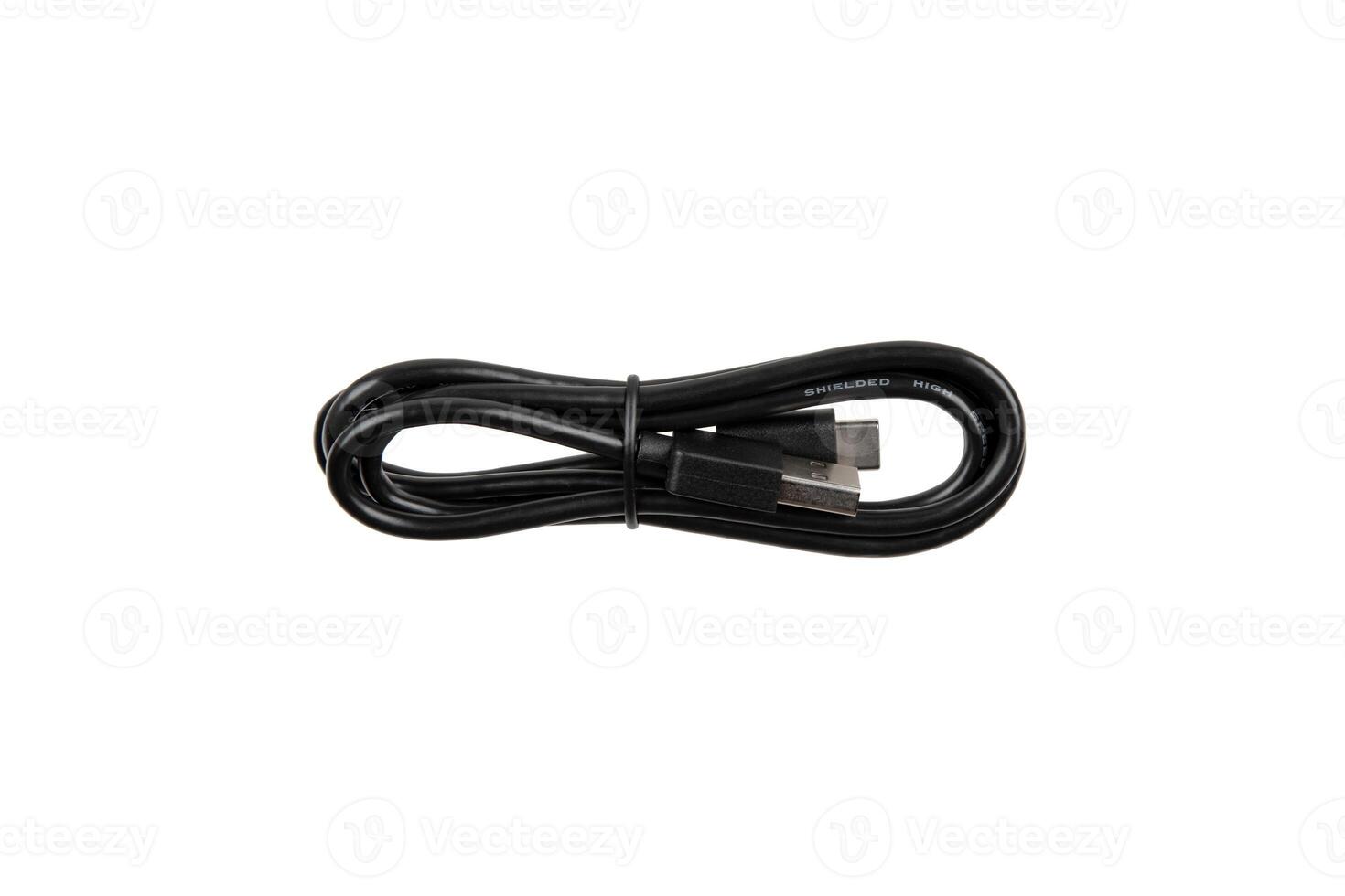 Black USB cable with two connectors, neatly coiled and secured with a strap, isolated on a white background. photo